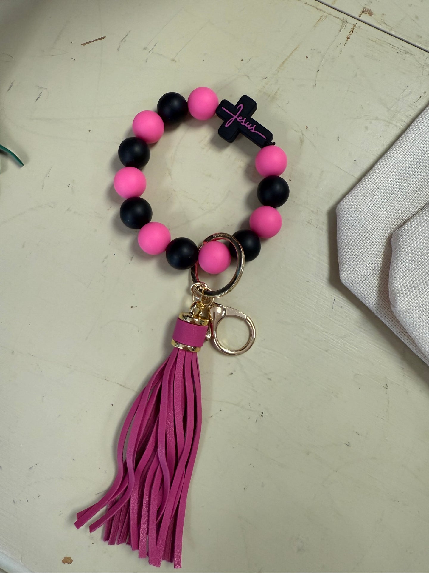 FlowingFaithCo - Handmade Silicone Bracelet Key Chain with Tassle Jesus